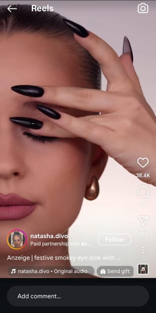 Natasha Divo applying festive smokey eye makeup using ABH’s Mini Sugar palette, with product close-ups and glam lighting.